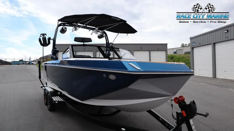 Slide: The Image of 2024 Nautique GS24 boat on trailer at Race City Marine dealership. - 4
