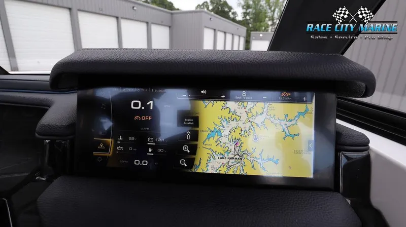 Slide: The Image of 2024 Nautique GS24 boat dashboard with navigation screen at Race City Marine. - 40