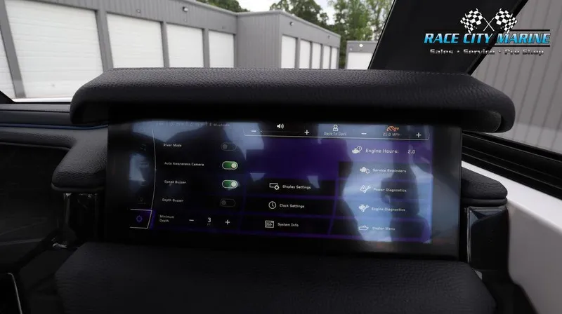 Slide: The Image of 2024 Nautique GS24 touchscreen dashboard display with various control settings. - 41