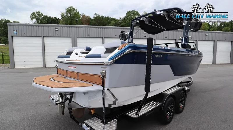 Slide: The Image of 2024 Nautique GS24 boat on trailer at Race City Marine dealership. - 7