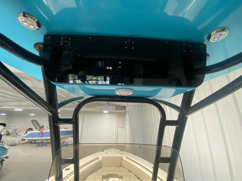 Slide: The Image of 2024 Key West 219 FS boat interior with blue T-top and black frame. - 13