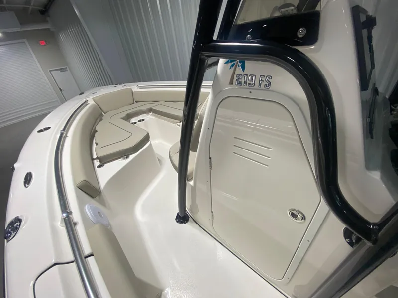 Slide: The Image of 2024 Key West 219 FS boat interior with seating and storage compartments. - 15
