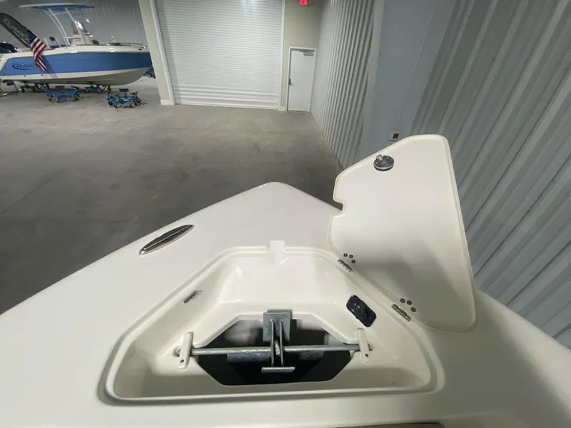 Slide: The Image of 2024 Key West 219 FS boat anchor compartment in a storage facility. - 22