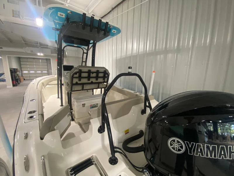 Slide: The Image of 2024 Key West 219 FS boat with Yamaha engine in a showroom. - 4