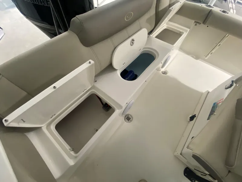 Slide: The Image of 2024 Key West 219 FS boat interior with open storage compartments. - 8