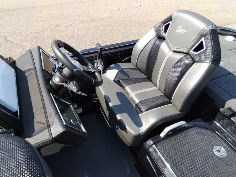 Slide: The Image of 2024 Ranger Z521R Ranger Cup Equipped boat cockpit with steering wheel and captain's seat. - 6