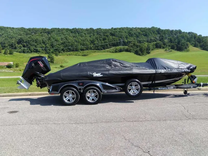 Slide: The Image of 2024 Ranger Z521R Ranger Cup Equipped boat with cover on trailer, parked on road. - 8