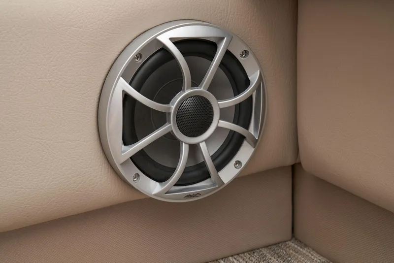 Slide: The Image of 2024 Ranger Reata 220F boat speaker in beige interior. - 57
