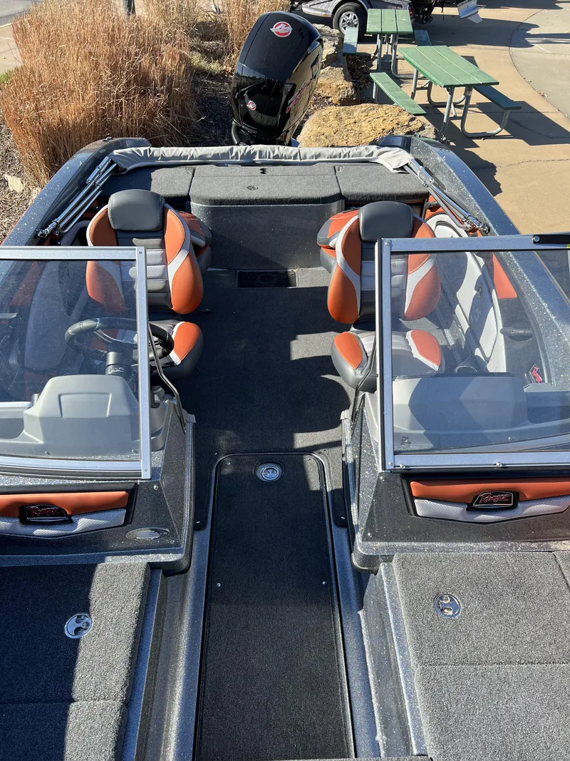 Slide: The Image of 2024 Ranger 1850MS boat with dual consoles and orange-accented seats. - 10