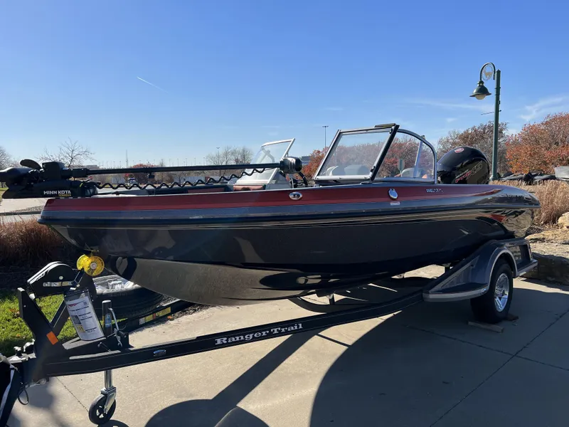 Slide: The Image of 2024 Ranger 1850MS fishing boat on trailer in outdoor setting. - 3
