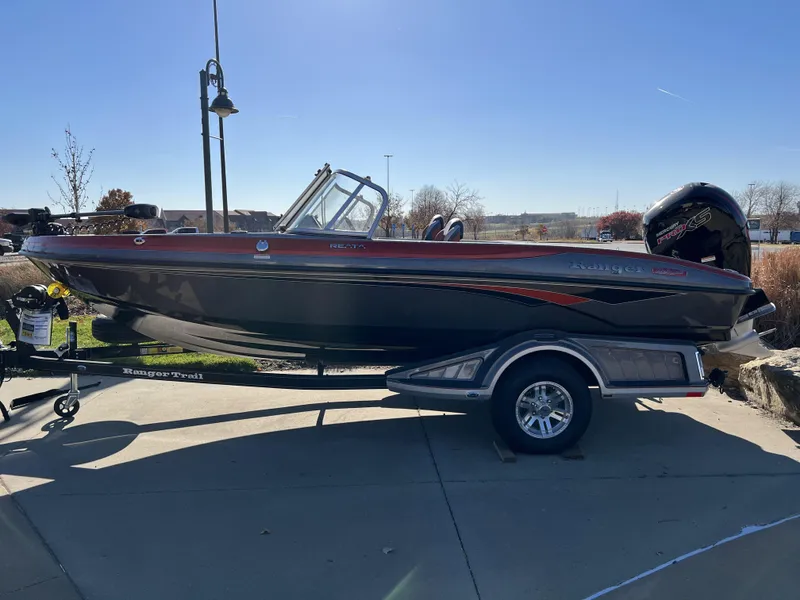 Slide: The Image of 2024 Ranger 1850MS boat on a trailer in a sunny outdoor setting. - 4