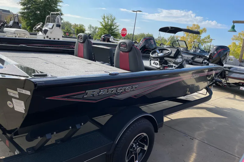 The Image of 2024 Ranger RT198P fishing boat in black, parked outdoors. - 1