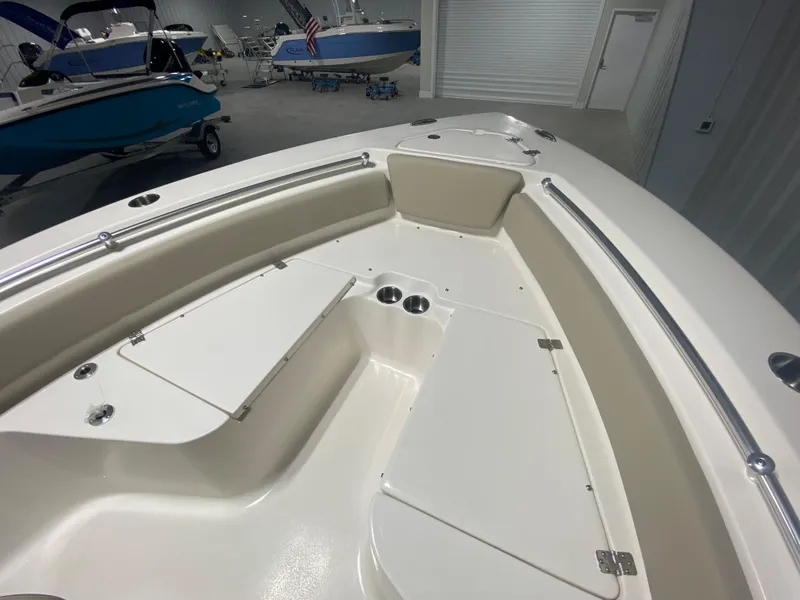 Slide: The Image of 2024 Key West 219 FS boat interior, spacious seating and storage compartments. - 19