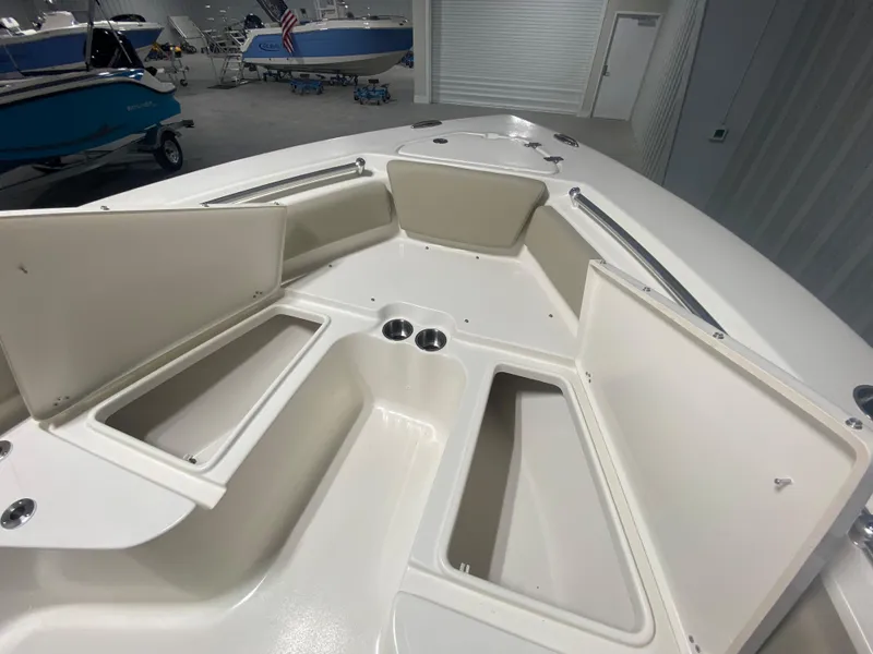 Slide: The Image of 2024 Key West 219 FS boat interior with open storage compartments. - 21
