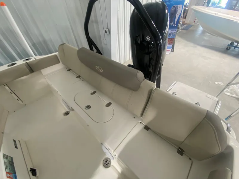 Slide: The Image of 2024 Key West 219 FS boat interior with cushioned seating and storage compartments. - 7