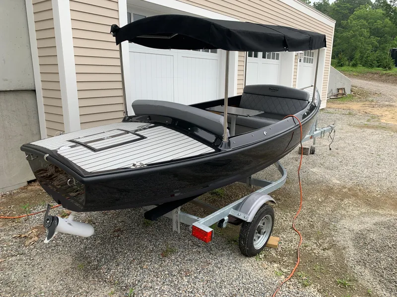 The Image of 2021 Vision Marine Technologies Quietude 156 electric boat on trailer with canopy. - 1