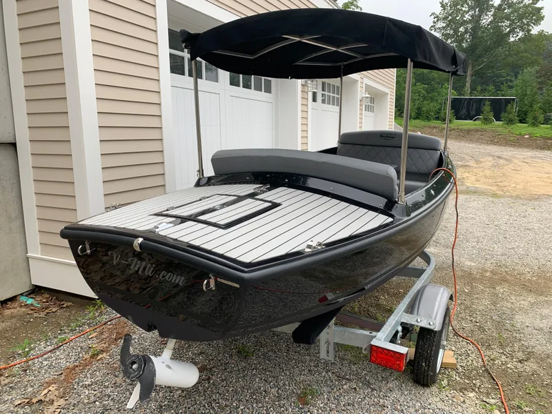 Slide: The Image of 2021 Vision Marine Technologies Quietude 156 electric boat on trailer. - 3