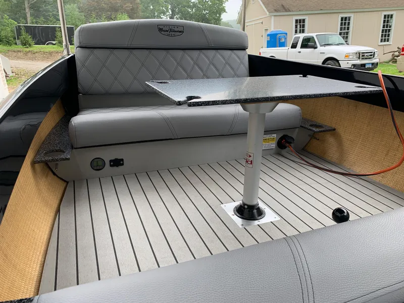 Slide: The Image of 2021 Vision Marine Technologies Quietude 156 boat interior with seating and table. - 8