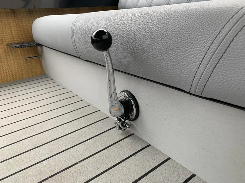 Slide: The Image of 2021 Vision Marine Technologies Quietude 156 boat interior with chrome throttle lever. - 9