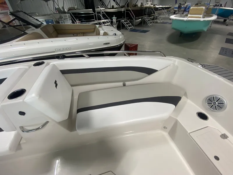 Slide: The Image of 2024 Starcraft SVX 171 boat interior with white and gray seating. - 13