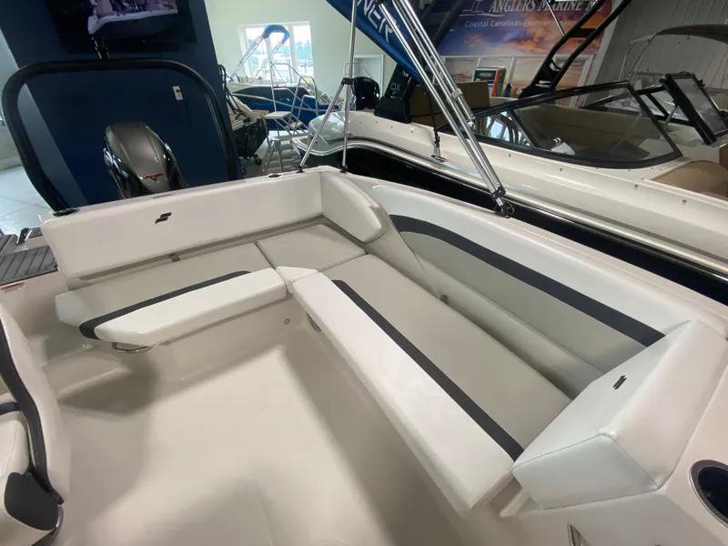 Slide: The Image of 2024 Starcraft SVX 171 boat interior with white seating and black accents. - 7