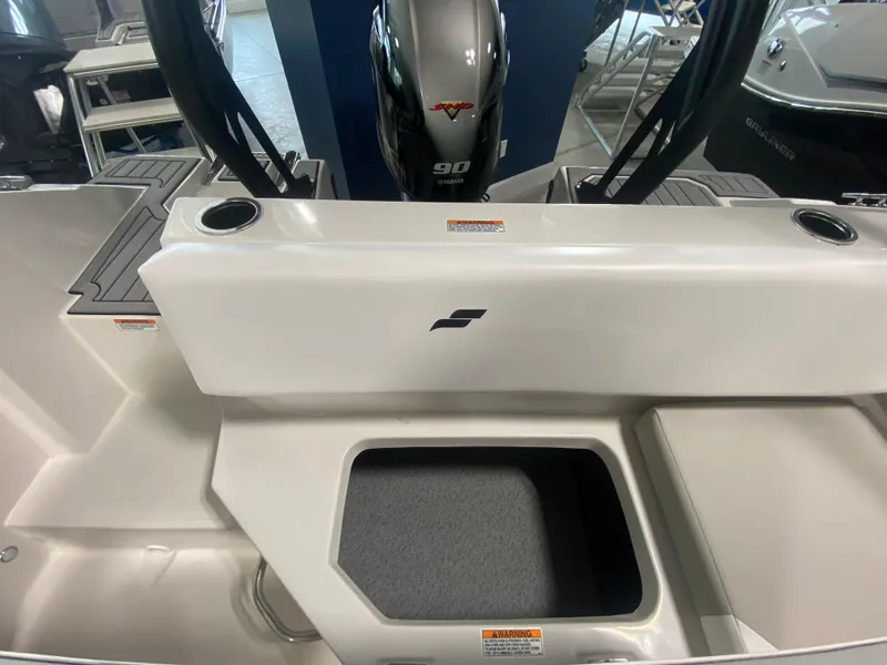 Slide: The Image of 2024 Starcraft SVX 171 boat interior with storage compartment and 90 HP engine. - 8
