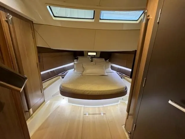 Slide: The Image of Luxurious cabin interior of 2018 Chris-Craft Launch 38 with a cozy bed. - 15