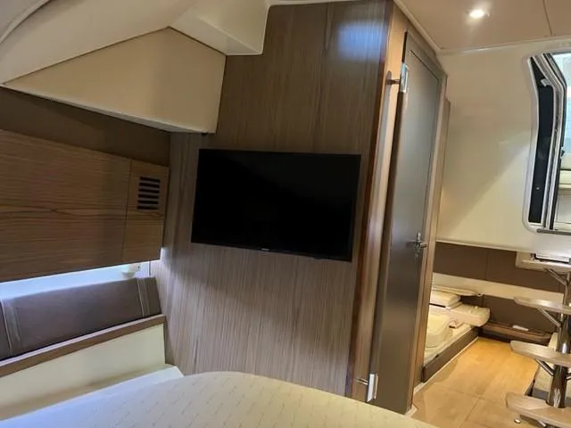 Slide: The Image of Interior of 2018 Chris-Craft Launch 38 with TV and wooden paneling. - 17