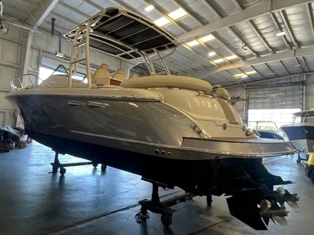 Slide: The Image of 2018 Chris-Craft Launch 38 boat in a warehouse, side view. - 2