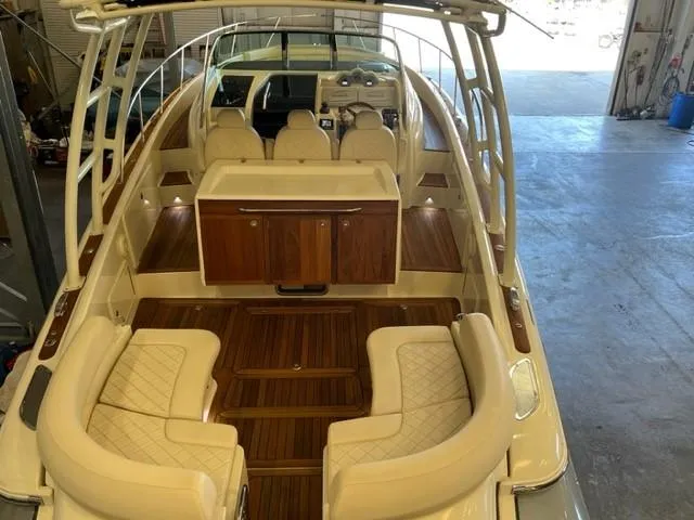 Slide: The Image of 2018 Chris-Craft Launch 38 boat interior with luxurious seating and wooden accents. - 7