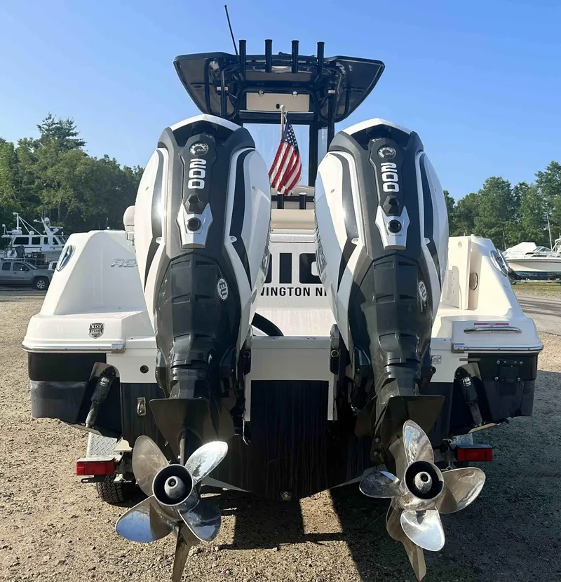 Slide: The Image of 2016 Robalo 2420 Center Console with twin 600 HP engines, rear view. - 3