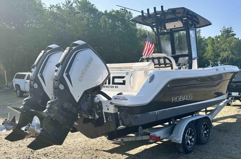 Slide: The Image of 2016 Robalo 2420 Center Console boat with twin outboard engines on a trailer. - 4