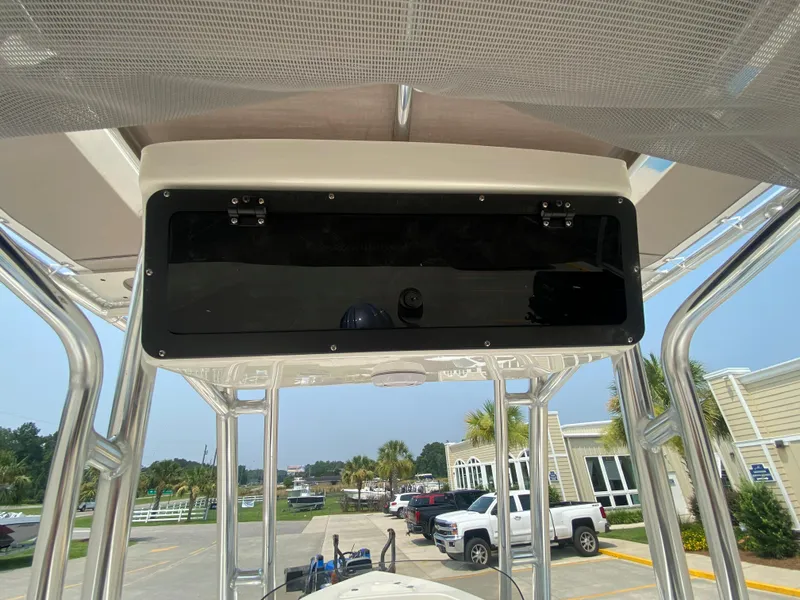 Slide: The Image of 2024 Key West 203 FS boat console with overhead storage compartment. - 14