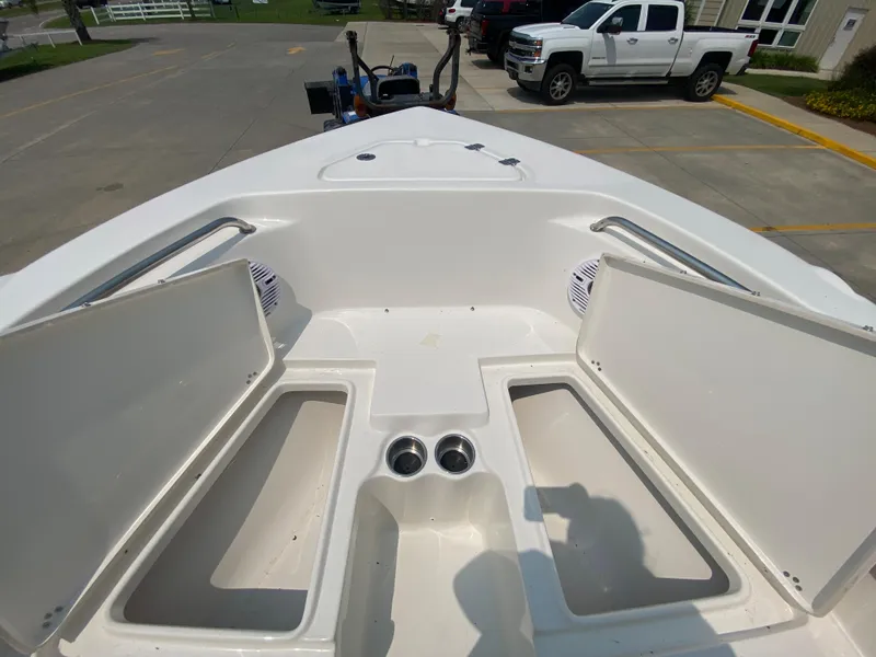 Slide: The Image of 2024 Key West 203 FS boat interior with open storage compartments. - 21