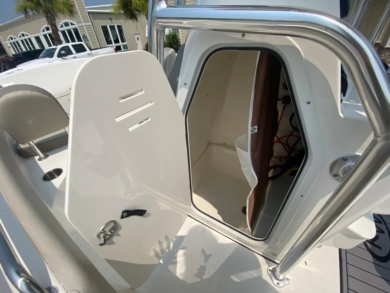 Slide: The Image of 2024 Key West 203 FS boat interior with open storage compartment. - 17
