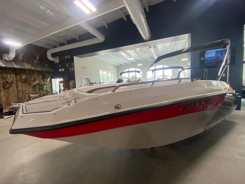 Slide: The Image of 2026 Starcraft SVX 171 boat displayed indoors, featuring sleek design and red accents. - 1