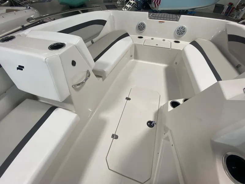 Slide: The Image of Interior of a 2026 Starcraft SVX 171 boat with seating and storage compartments. - 11