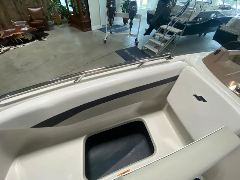 Slide: The Image of 2026 Starcraft SVX 171 boat interior with storage compartment in showroom. - 15