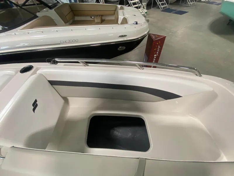 Slide: The Image of 2024 Starcraft SVX 171 boat interior, featuring seating and storage compartments. - 14