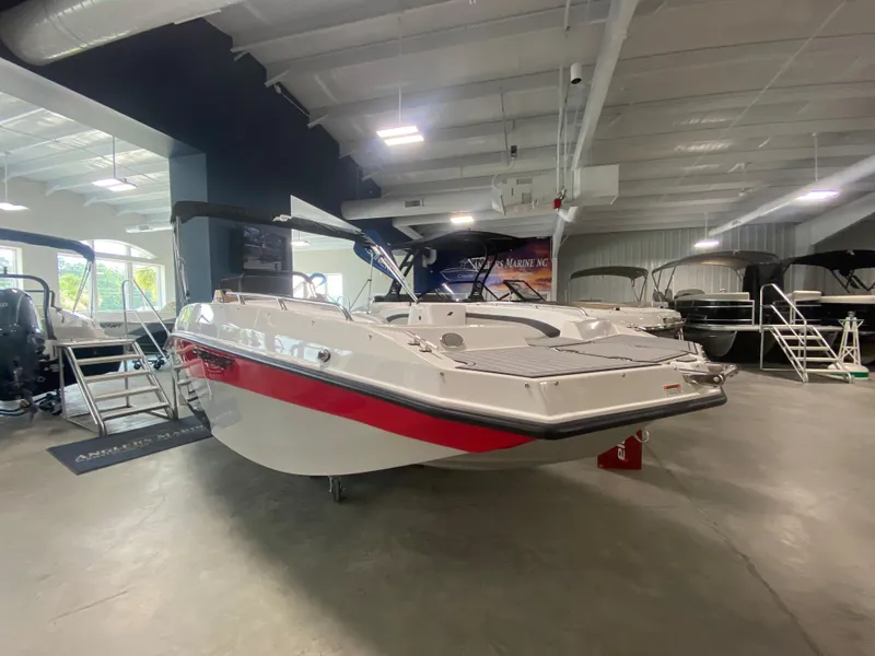 Slide: The Image of 2024 Starcraft SVX 171 boat displayed in a showroom. - 2