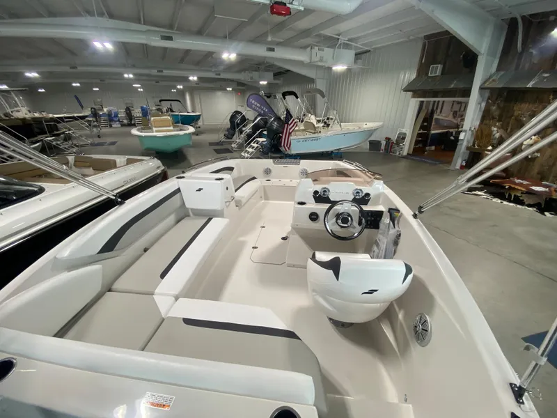 Slide: The Image of 2024 Starcraft SVX 171 boat interior in showroom. - 5