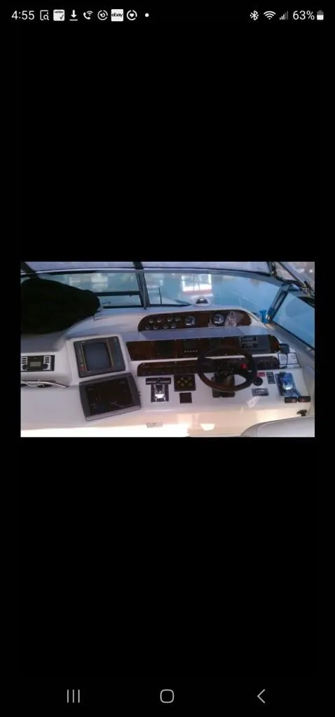 Slide: The Image of 1995 Sea Ray 450 Sundancer boat dashboard with navigation equipment - 11