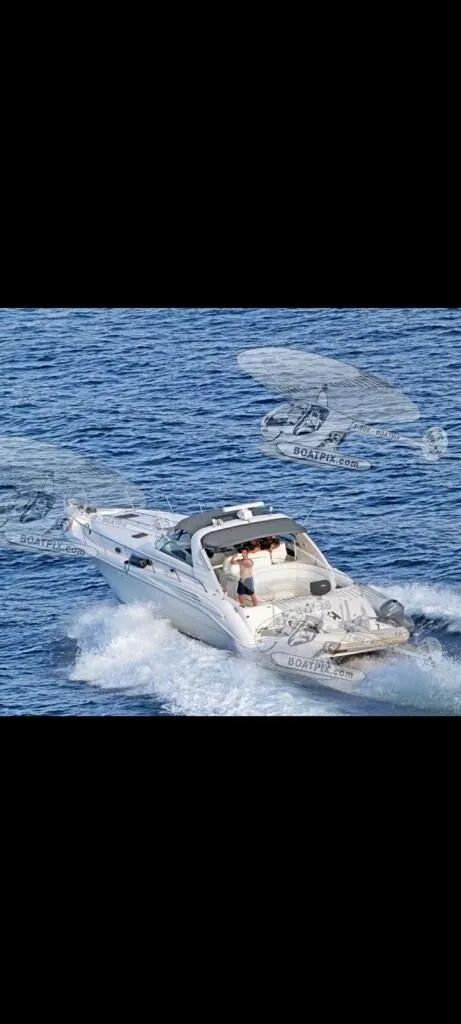 Slide: The Image of 1995 Sea Ray 450 Sundancer cruising on open water. - 6