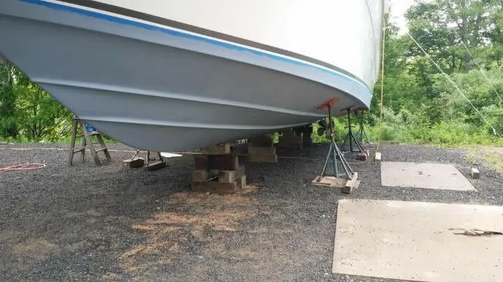 Slide: The Image of 1995 Sea Ray 450 Sundancer boat on dry dock for maintenance. - 7