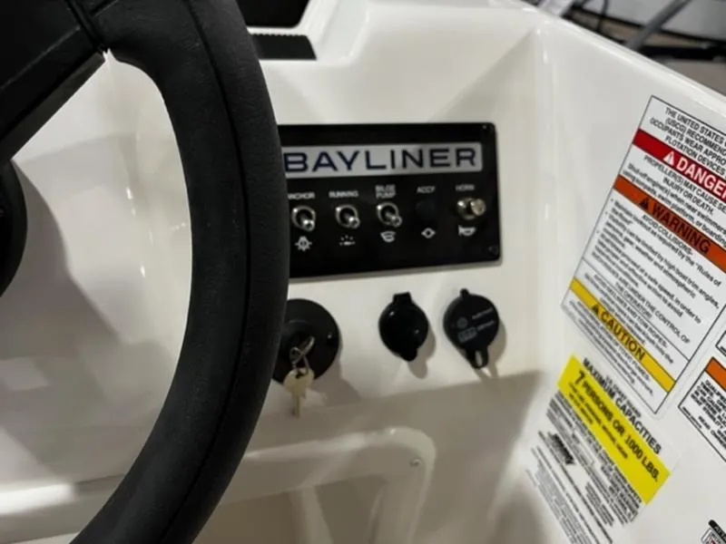 Slide: The Image of Close-up of 2024 Bayliner Element M17 boat dashboard and controls. - 10