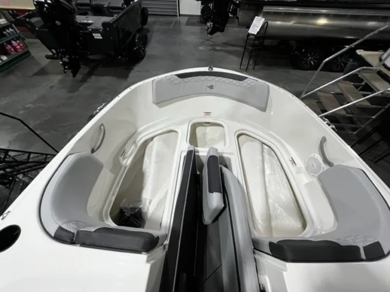 Slide: The Image of 2024 Bayliner Element M17 boat interior with seating and storage compartments. - 11
