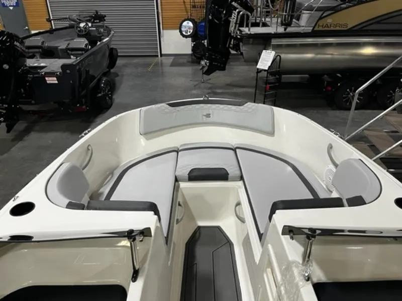 Slide: The Image of 2024 Bayliner Element M17 boat interior with gray and white seating. - 8