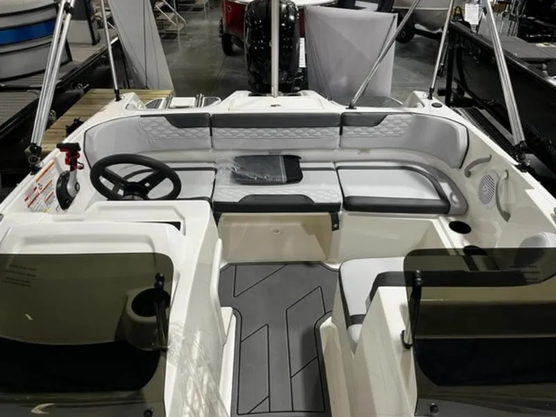 Slide: The Image of 2024 Bayliner Element M17 boat interior with seating and steering wheel. - 9