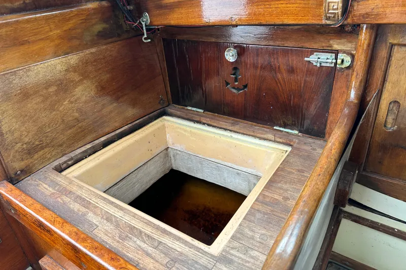 Slide: The Image of 1964 Cheoy Lee Lion Class Sloop wooden interior storage compartment. - 14