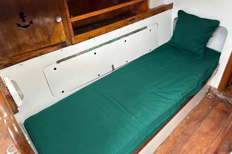 Slide: The Image of Interior cabin of 1964 Cheoy Lee Lion Class Sloop with green cushioned berth. - 22
